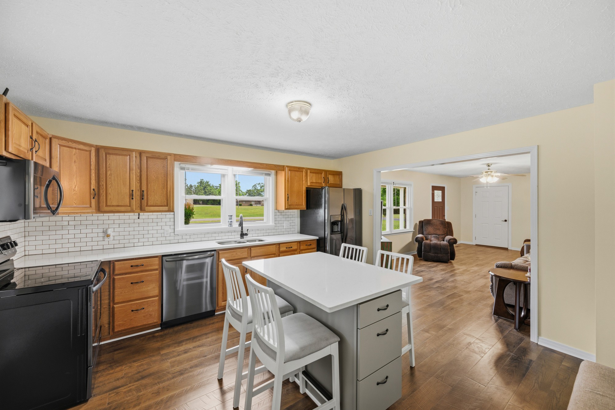 944 Brooksie Thompson Road Decaturville, TN 38329 - Photo 7 of 47 a large kitchen with a table and chairs in it