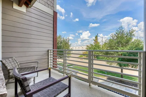 a view of a porch with furniture