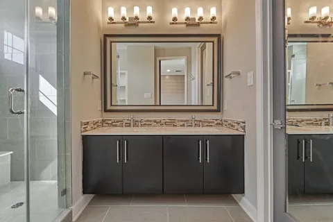 a view of a kitchen with a sink and cabinets