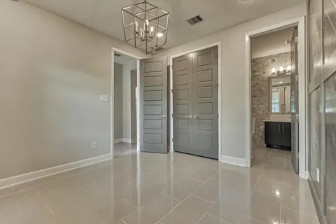 a view of a hallway with wooden shelves