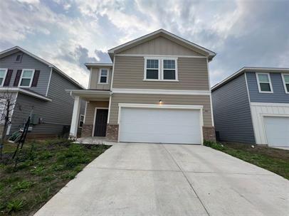 309 Redfish Lane Hutto, TX 78634 - Photo 1 of 15 a front view of a house with a yard and garage