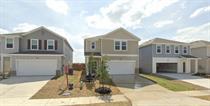 309 Redfish Lane Hutto, TX 78634 - Photo 2 of 15 a front view of a house with a garden