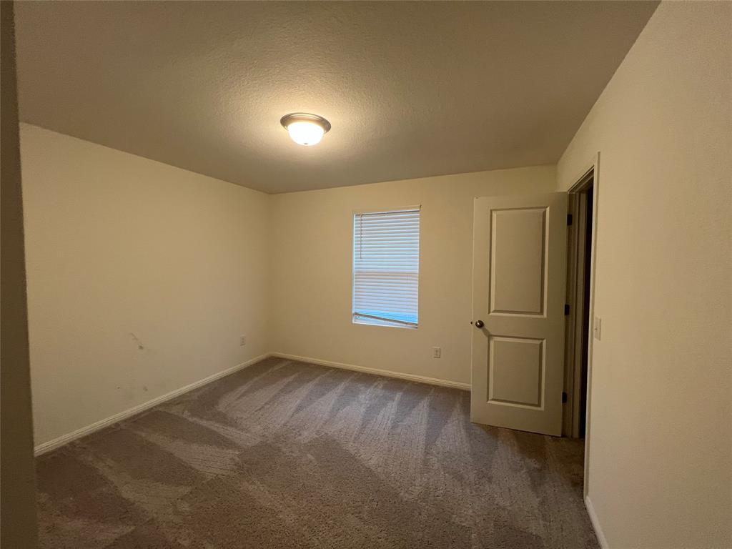309 Redfish Lane Hutto, TX 78634 - Photo 6 of 15 an empty room with windows