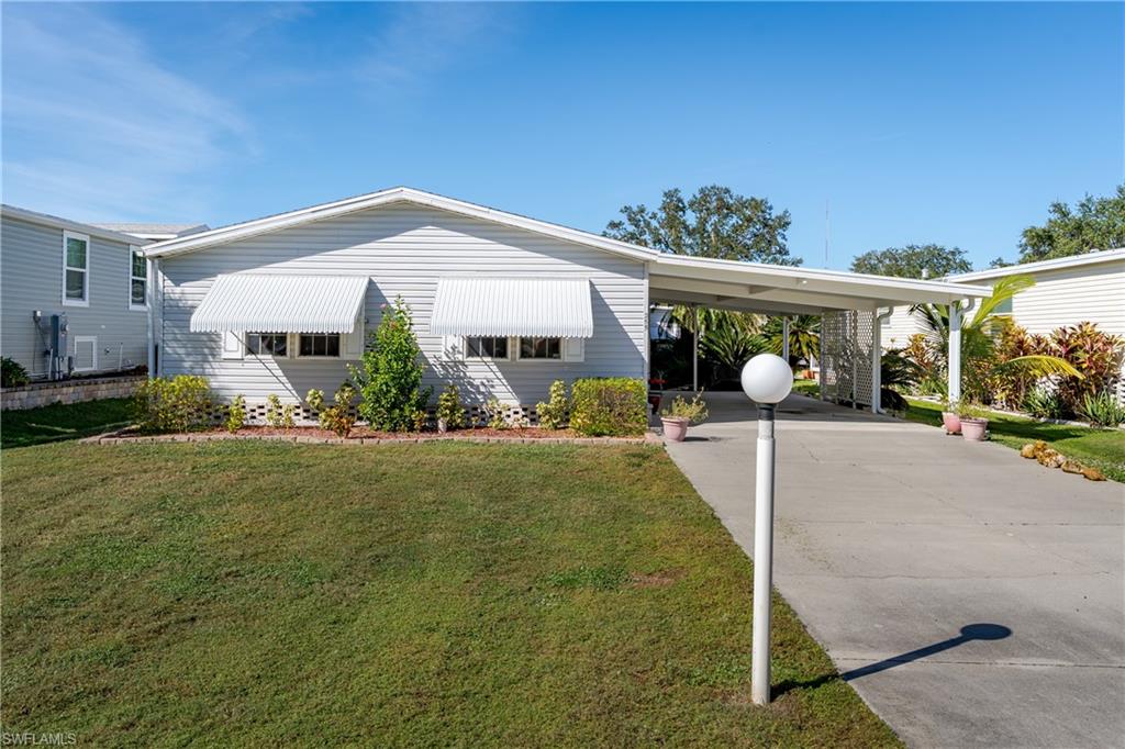 255 Riverwood Road Naples, FL 34114 - Photo 1 of 35 a view of a backyard house and garden