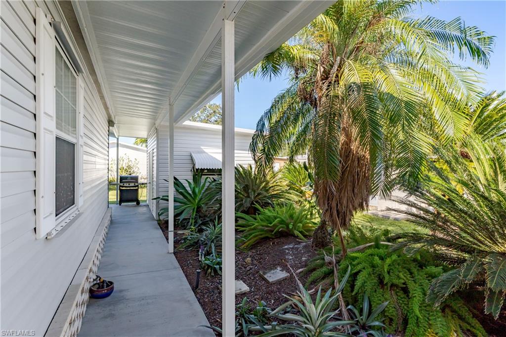255 Riverwood Road Naples, FL 34114 - Photo 29 of 35 a view of entryway with garden