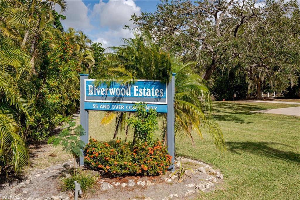 255 Riverwood Road Naples, FL 34114 - Photo 33 of 35 a sign that is on a brick wall