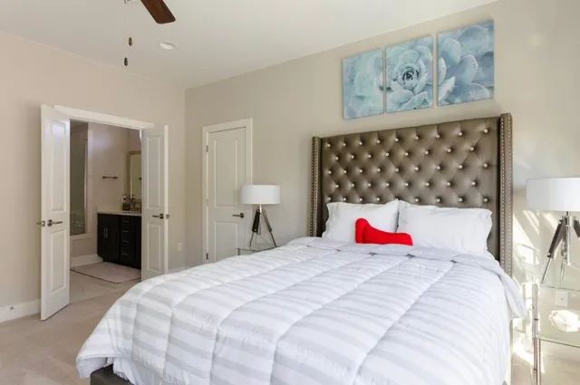 a bedroom with bed and cupboard