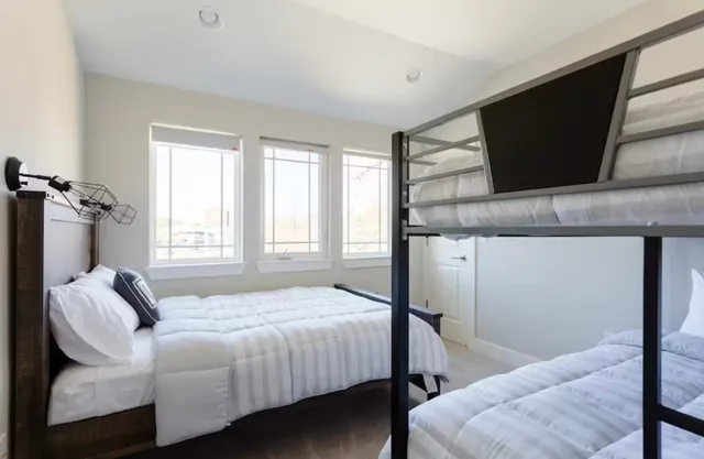 a bedroom with a bed and a television