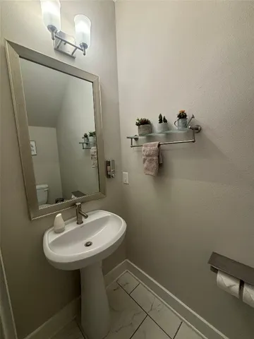 a bathroom with a sink and mirror