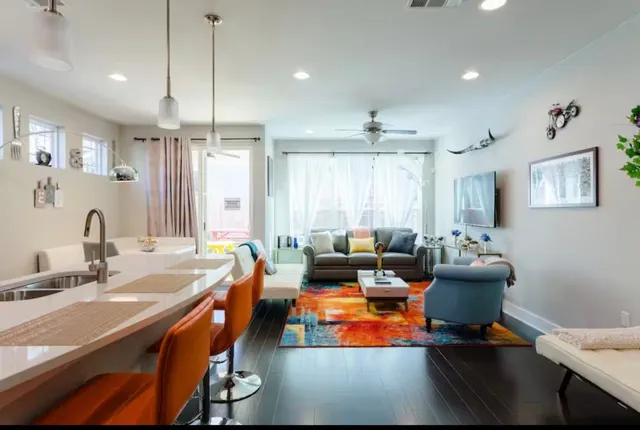 a room with furniture pool table and a window