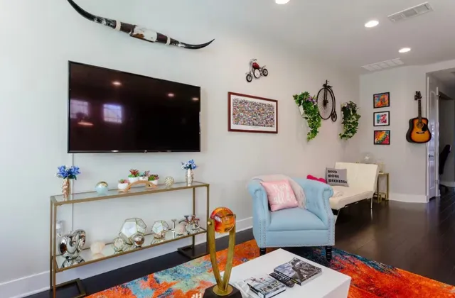 a living room with furniture and flat screen tv