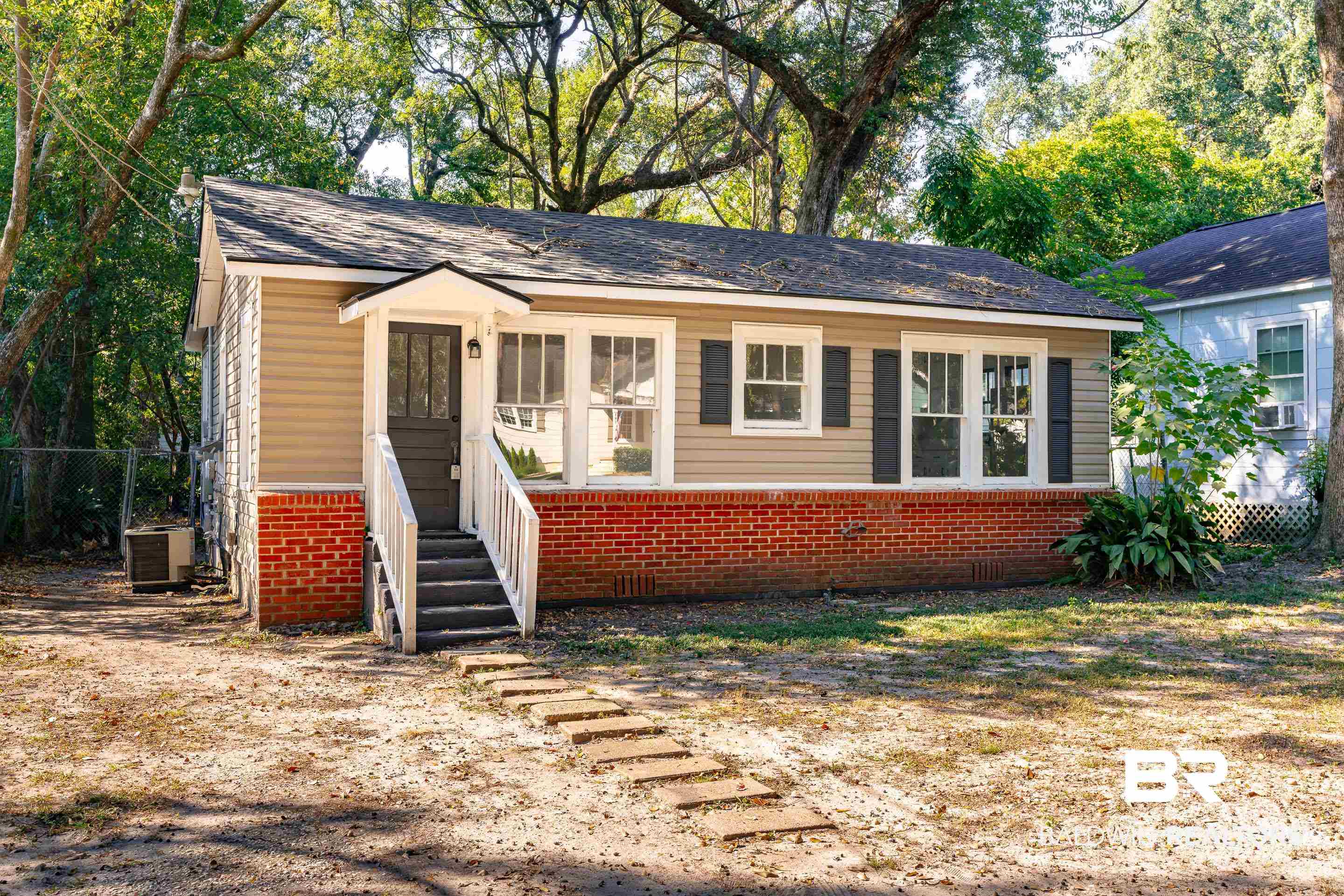 166 Crenshaw Street Mobile, AL 36606 - Photo 23 of 24 View of front facade featuring central AC unit