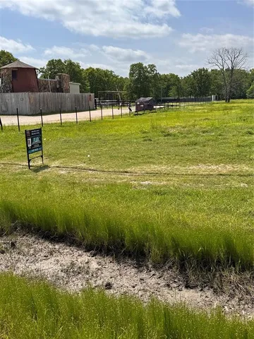 a view of a golf course with a lake