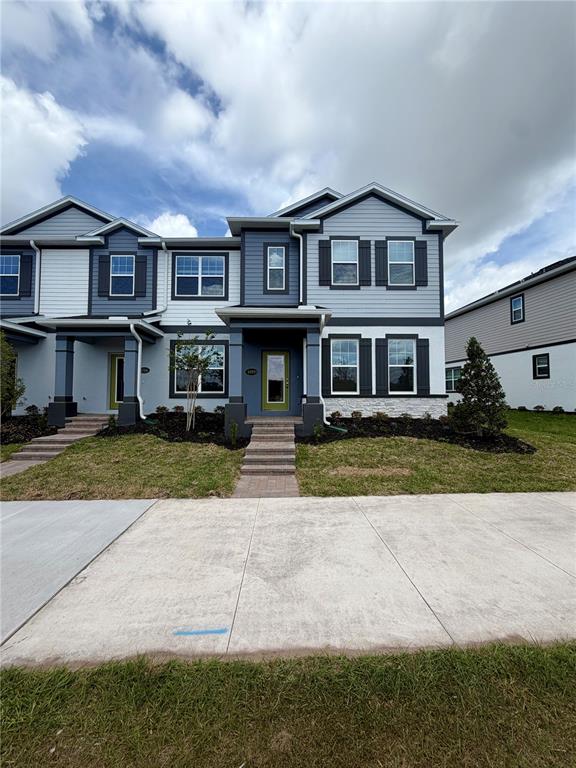 5222 Ctr Lk Rnch Boulevard St. Cloud, FL 34771 - Photo 1 of 25 a front view of a residential apartment building with a yard
