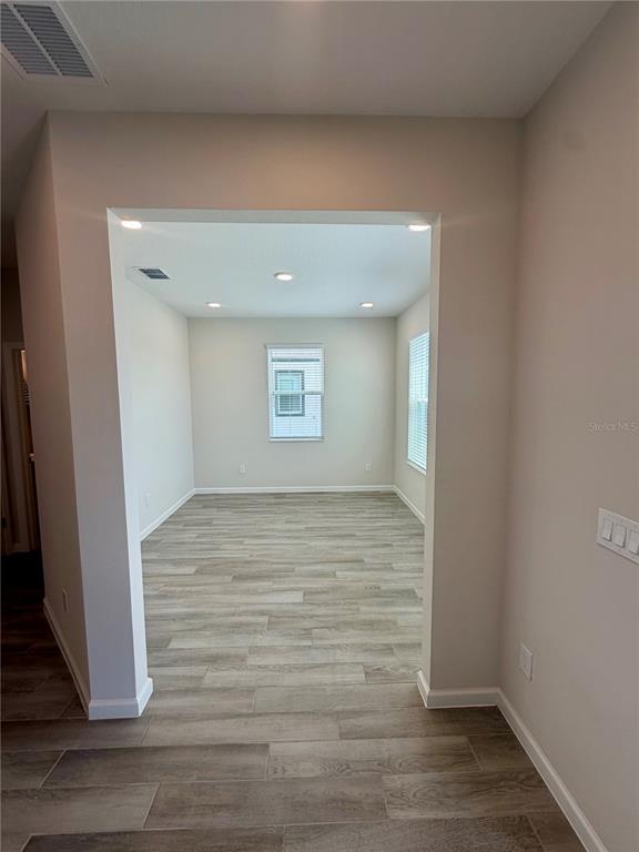5222 Ctr Lk Rnch Boulevard St. Cloud, FL 34771 - Photo 11 of 25 a view of an empty room and wooden floor