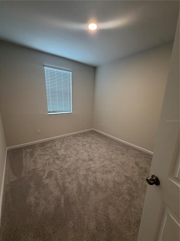 5222 Ctr Lk Rnch Boulevard St. Cloud, FL 34771 - Photo 14 of 25 an empty room with a workbench