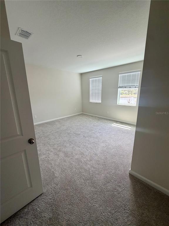 5222 Ctr Lk Rnch Boulevard St. Cloud, FL 34771 - Photo 24 of 25 an empty room with windows