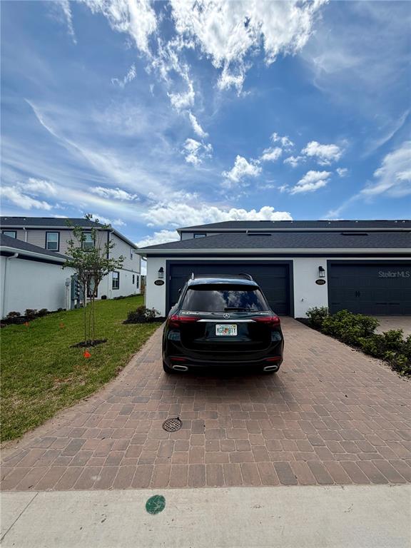 5222 Ctr Lk Rnch Boulevard St. Cloud, FL 34771 - Photo 25 of 25 a car parked in the grass of a house