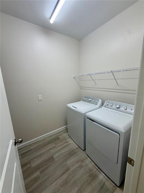 5222 Ctr Lk Rnch Boulevard St. Cloud, FL 34771 - Photo 9 of 25 a utility room with dryer and washer