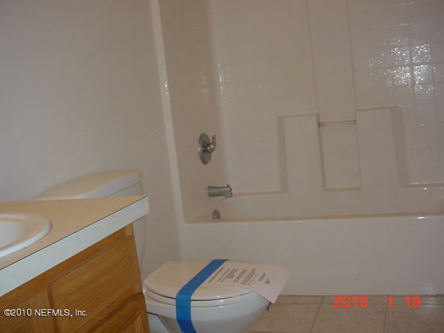 2159 Tuskegee Road Jacksonville, FL 32209 - Photo 8 of 8 a bathroom with a bathtub and shower