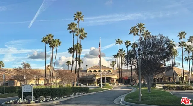 a view of a city with palm trees