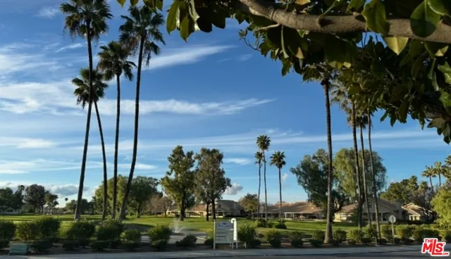 a view of a swimming pool with a table and chairs
