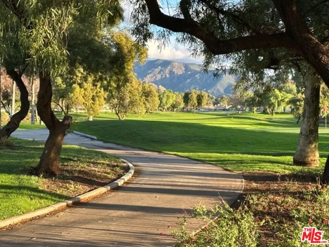 a room with pool table and windows