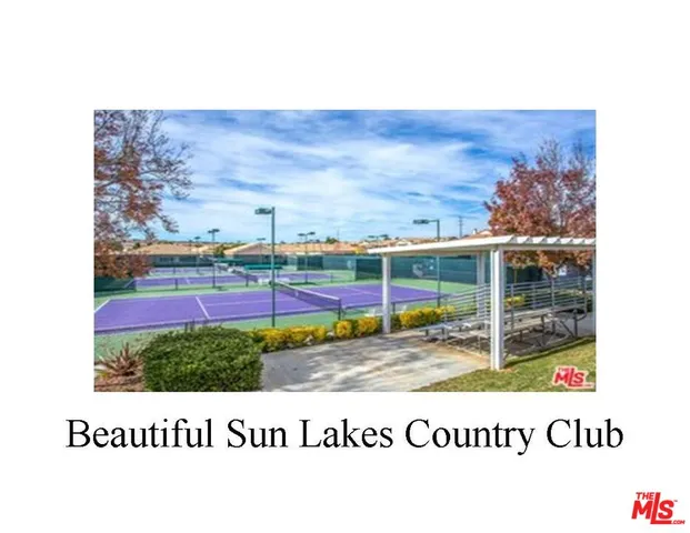 a view of a swimming pool with a yard