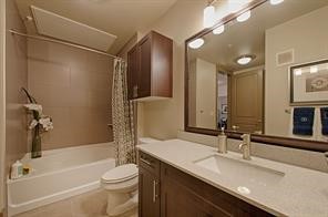 2033 South Gessner Road, Unit 3220 Houston, TX 77063 - Photo 8 of 20 a bathroom with a granite countertop sink toilet and shower