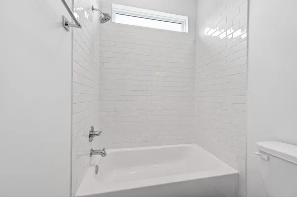 a close up of a bathtub in a bathroom