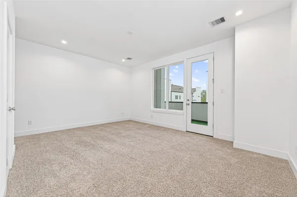 a living room with furniture rug and lamp
