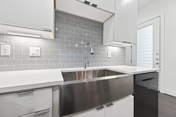 a kitchen with a sink and cabinets