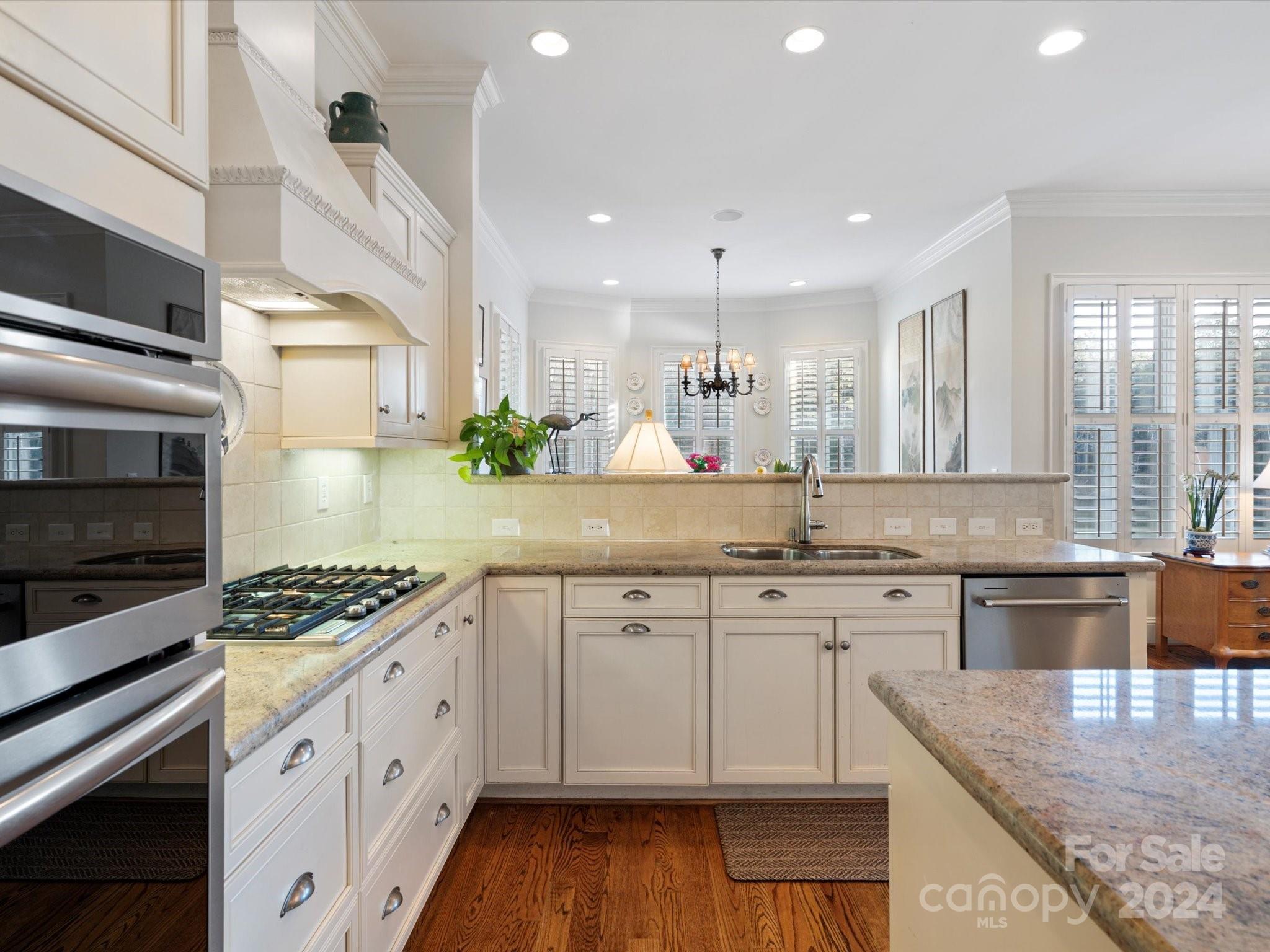 135 Spring Branch Road Fort Mill, SC 29715 - Photo 13 of 48 a kitchen with stainless steel appliances granite countertop a stove a sink and a microwave