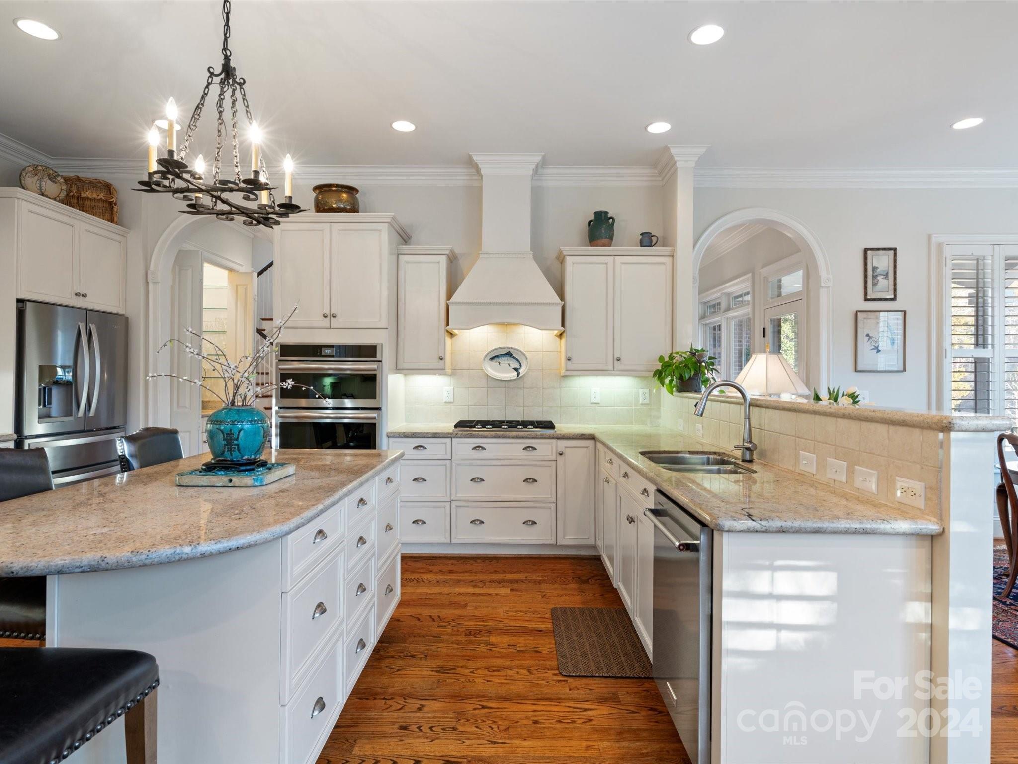 135 Spring Branch Road Fort Mill, SC 29715 - Photo 14 of 48 a large kitchen with kitchen island granite countertop a sink and a stove