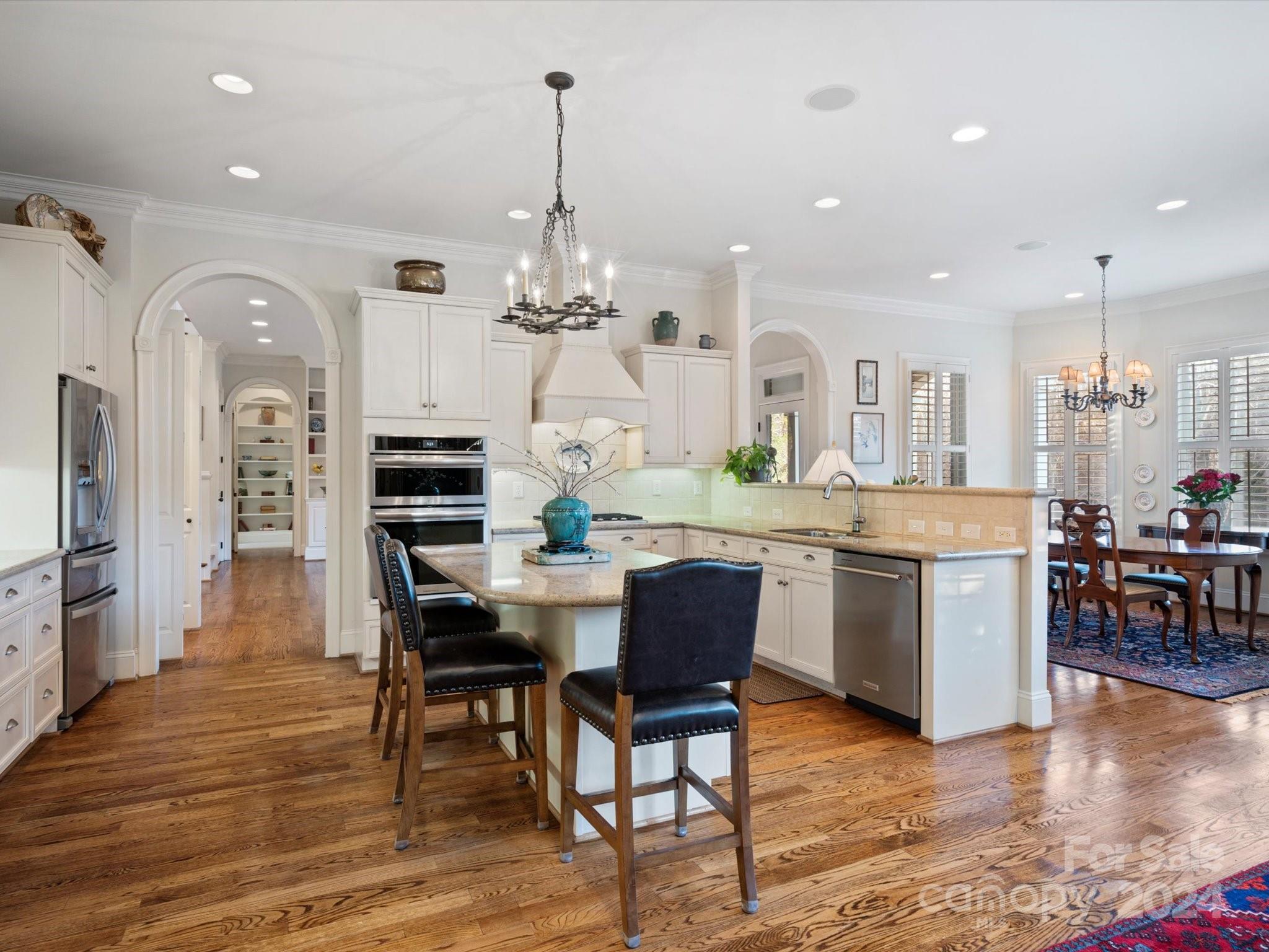 135 Spring Branch Road Fort Mill, SC 29715 - Photo 16 of 48 a large kitchen with a table and chairs