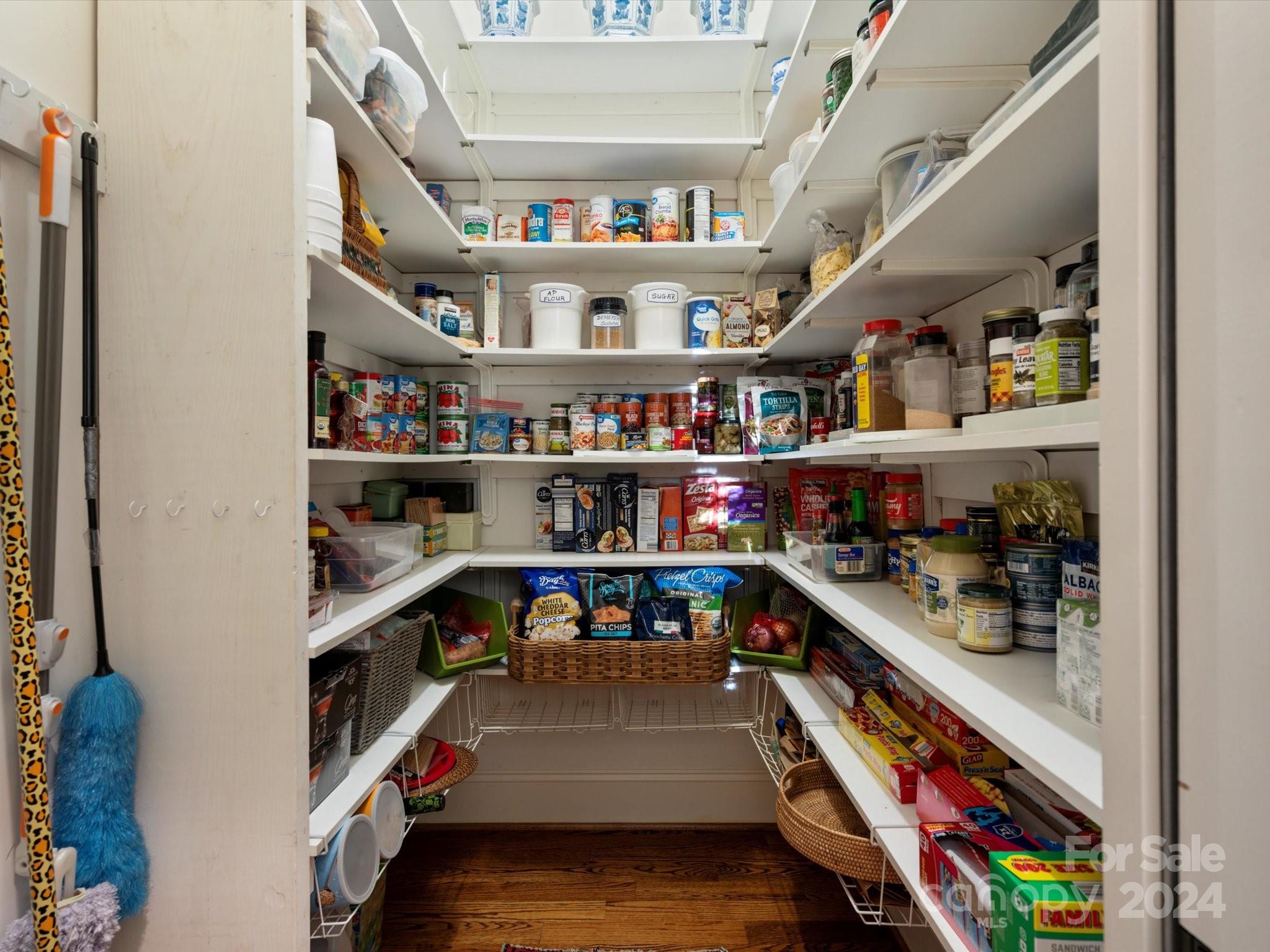 135 Spring Branch Road Fort Mill, SC 29715 - Photo 20 of 48 a room with lots of books and a refrigerator