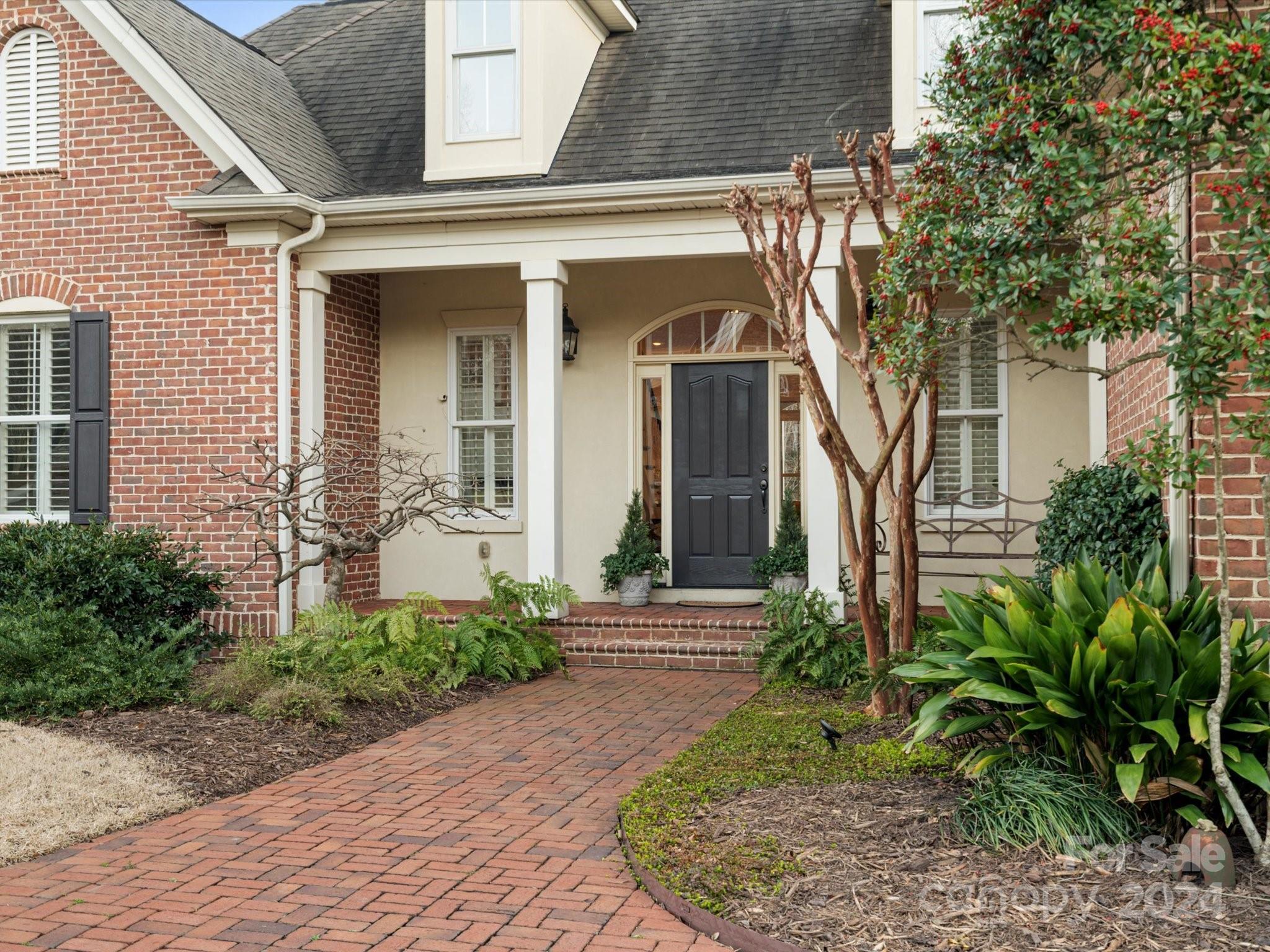 135 Spring Branch Road Fort Mill, SC 29715 - Photo 2 of 48 a front view of a house with garden