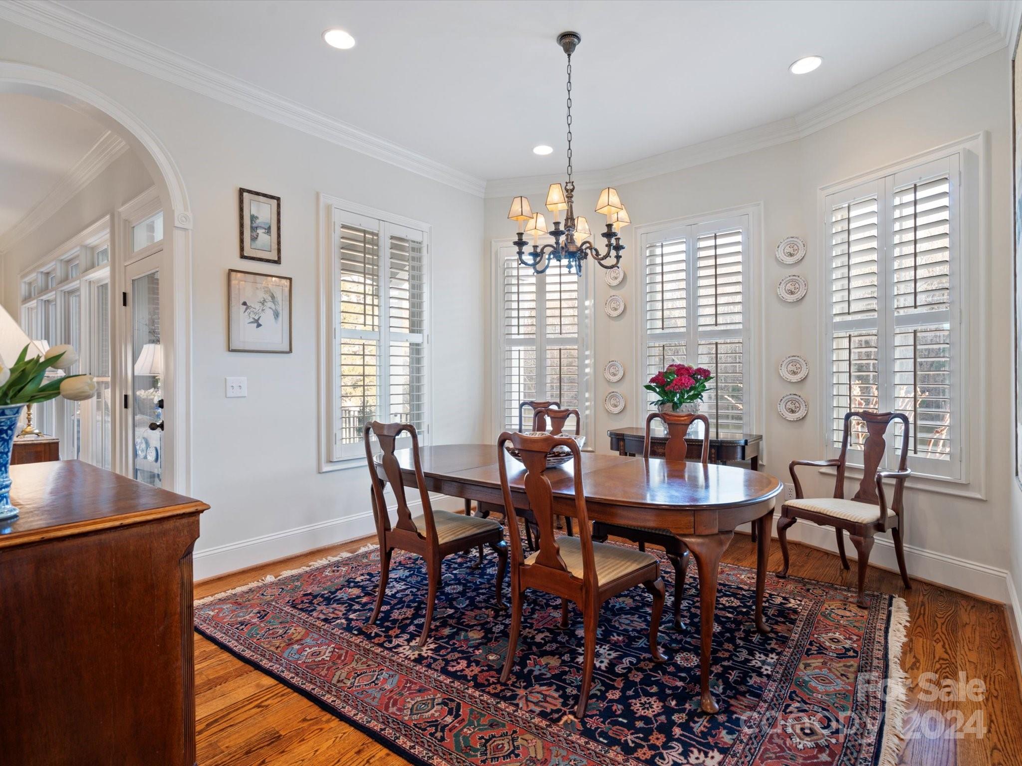 135 Spring Branch Road Fort Mill, SC 29715 - Photo 21 of 48 a view of a dining room with furniture window and wooden floor