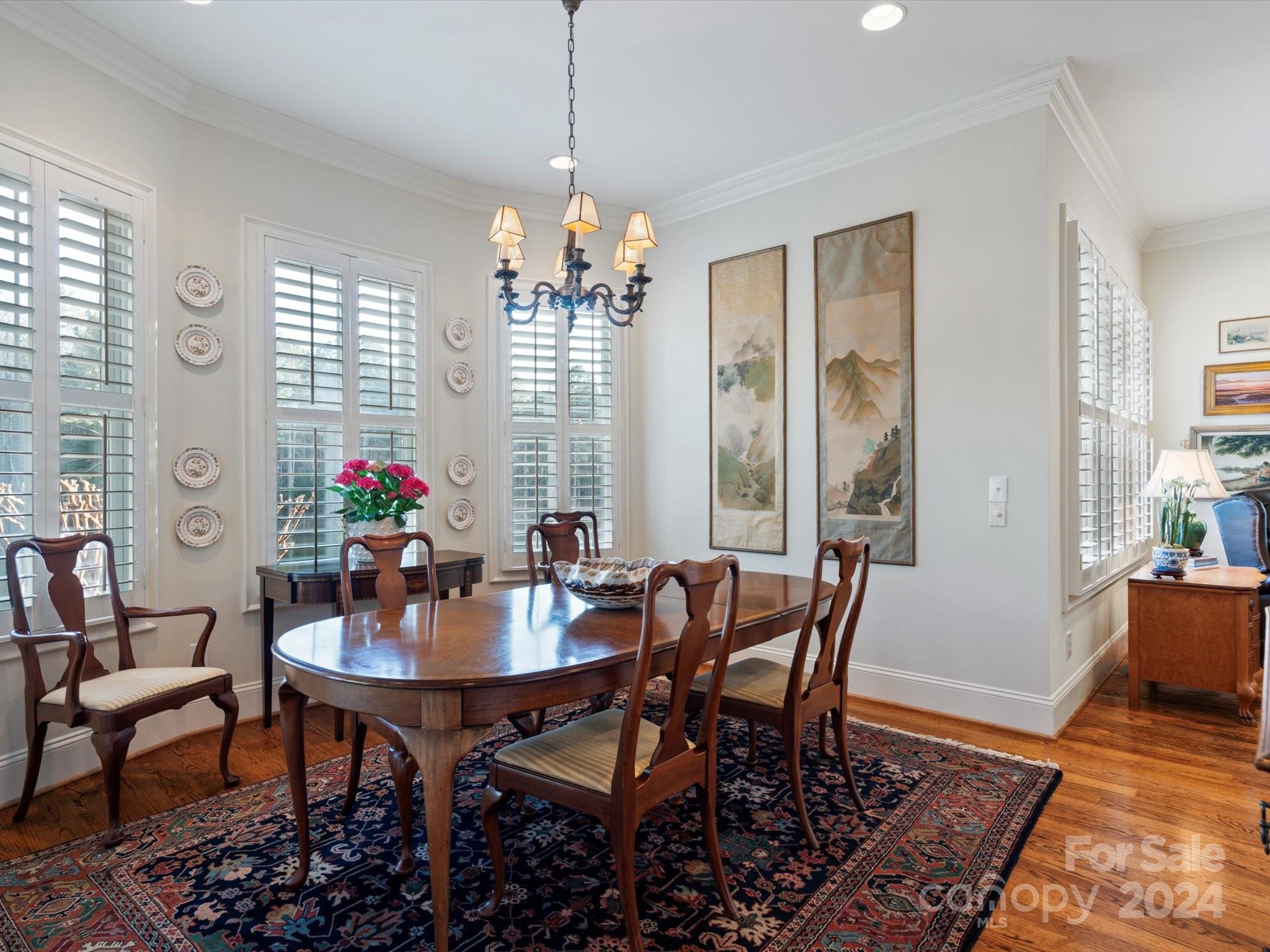 135 Spring Branch Road Fort Mill, SC 29715 - Photo 22 of 48 a view of a dining room with furniture window and wooden floor