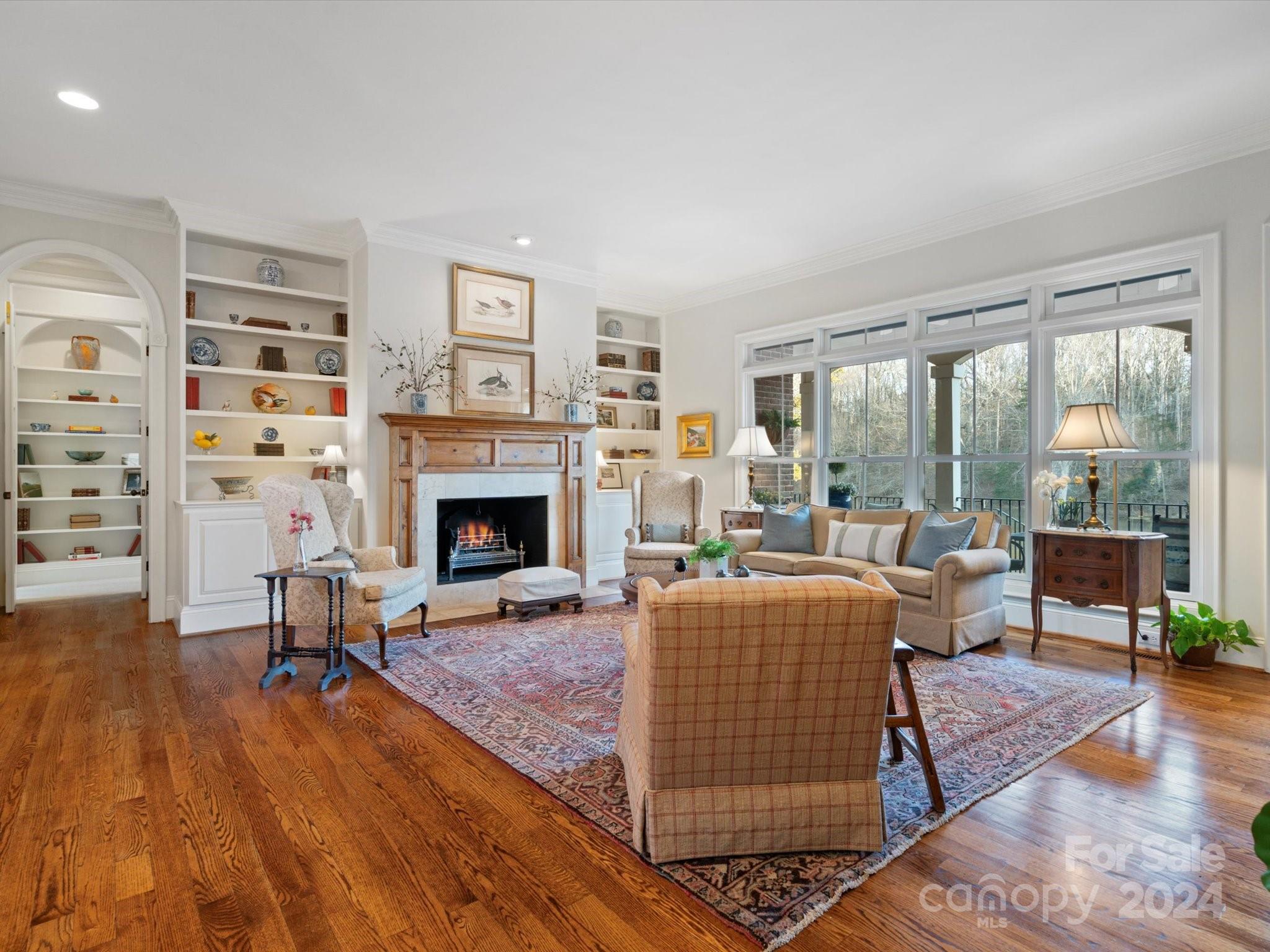 135 Spring Branch Road Fort Mill, SC 29715 - Photo 25 of 48 a living room with furniture large window and a fireplace