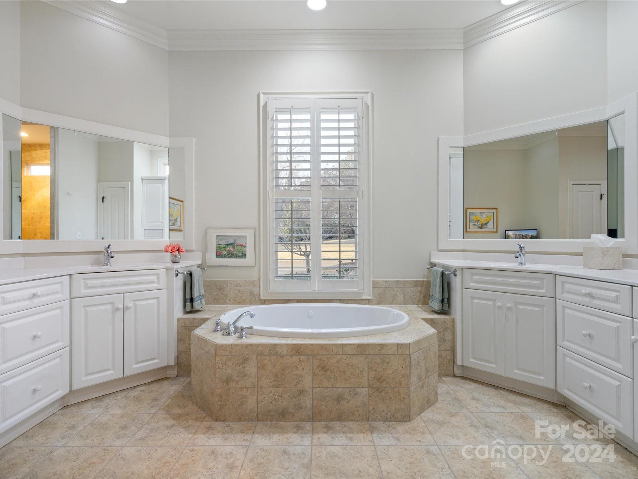 135 Spring Branch Road Fort Mill, SC 29715 - Photo 30 of 48 a spacious bathroom with a tub sink and mirror