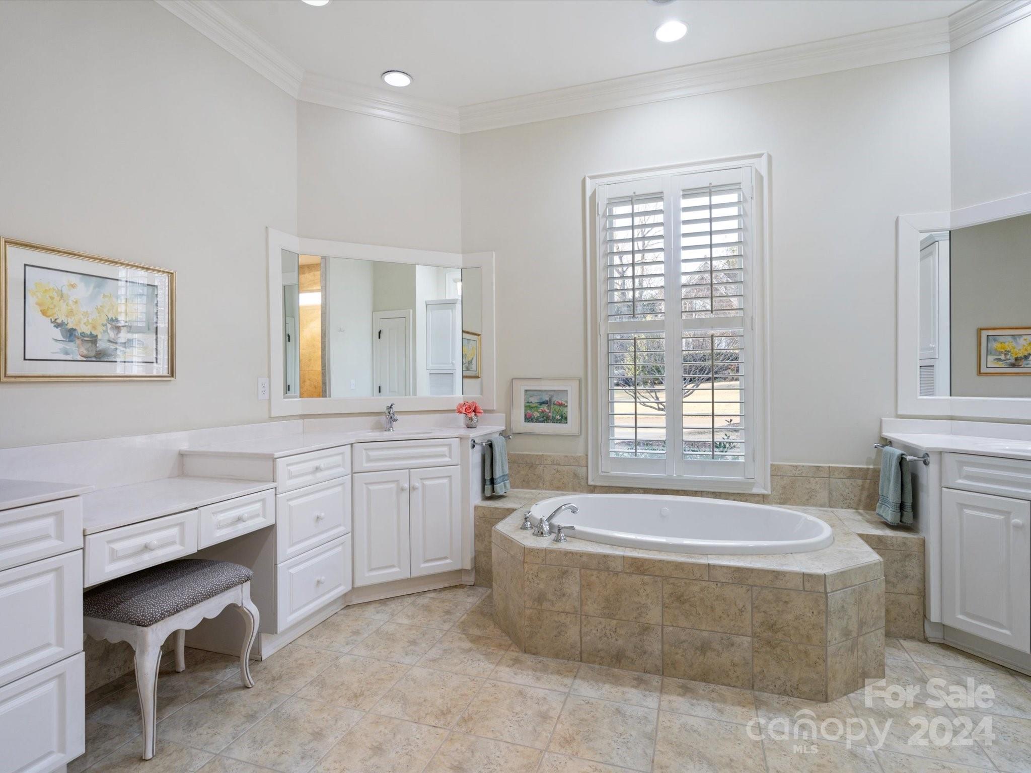 135 Spring Branch Road Fort Mill, SC 29715 - Photo 31 of 48 a spacious bathroom with a tub sink and mirror