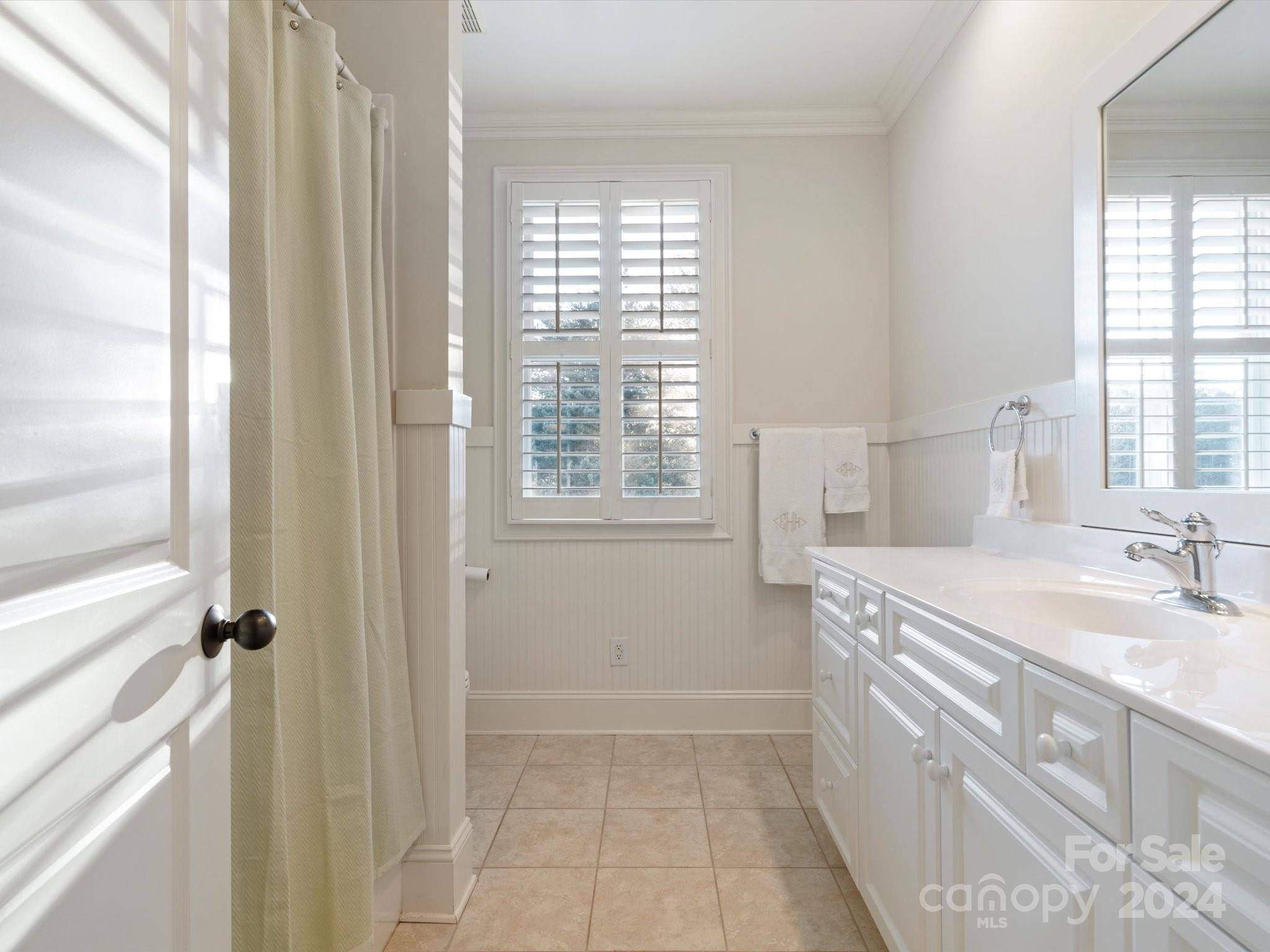 135 Spring Branch Road Fort Mill, SC 29715 - Photo 35 of 48 a spacious bathroom with a granite countertop sink a mirror and a shower