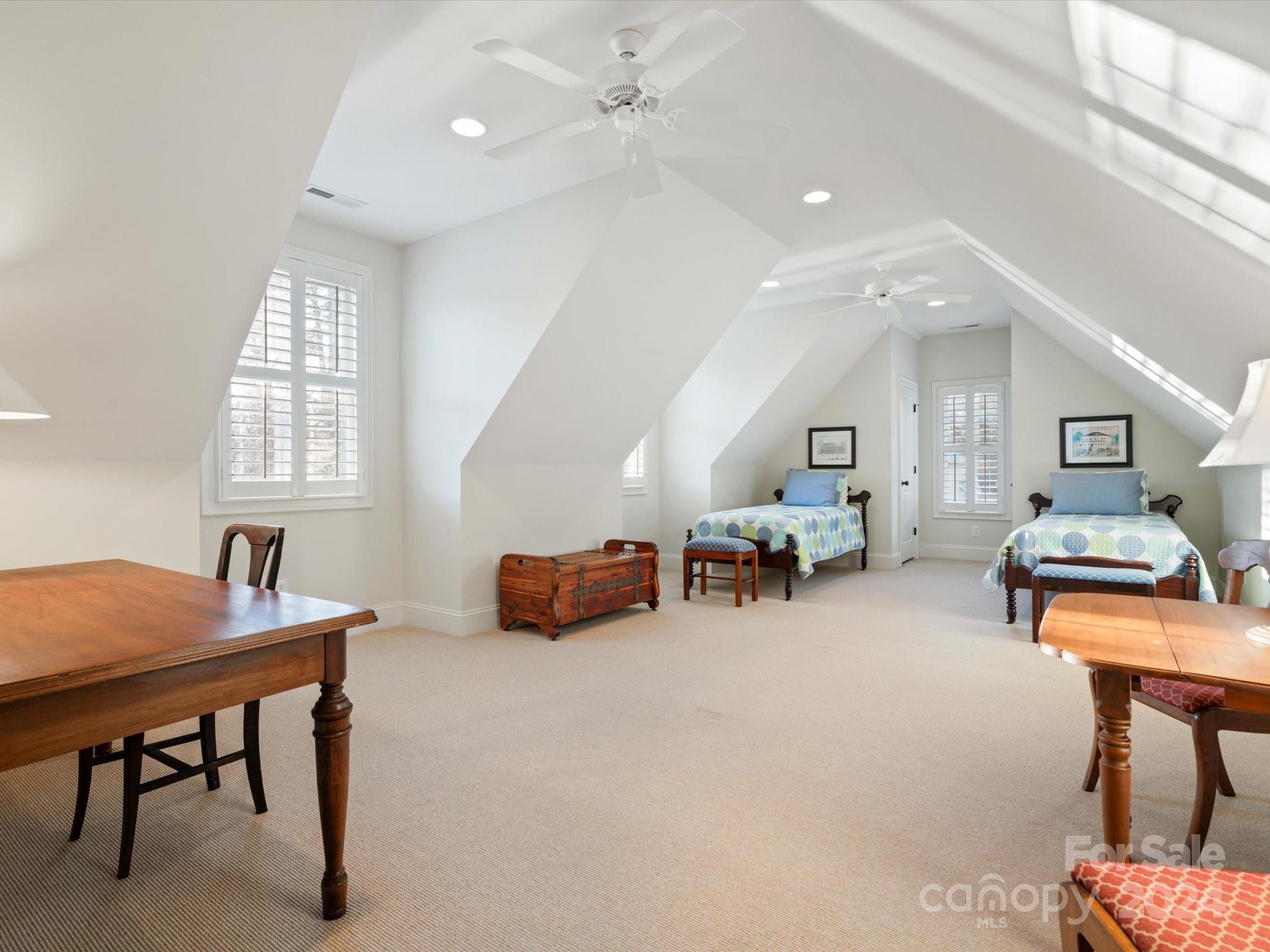 135 Spring Branch Road Fort Mill, SC 29715 - Photo 37 of 48 a room with furniture and a chandelier