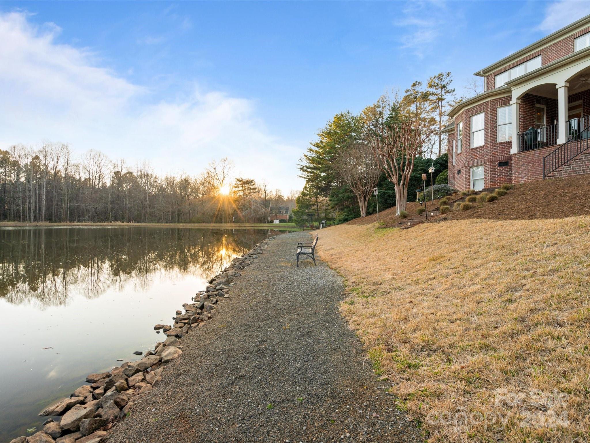 135 Spring Branch Road Fort Mill, SC 29715 - Photo 43 of 48 a view of a lake with houses in the background