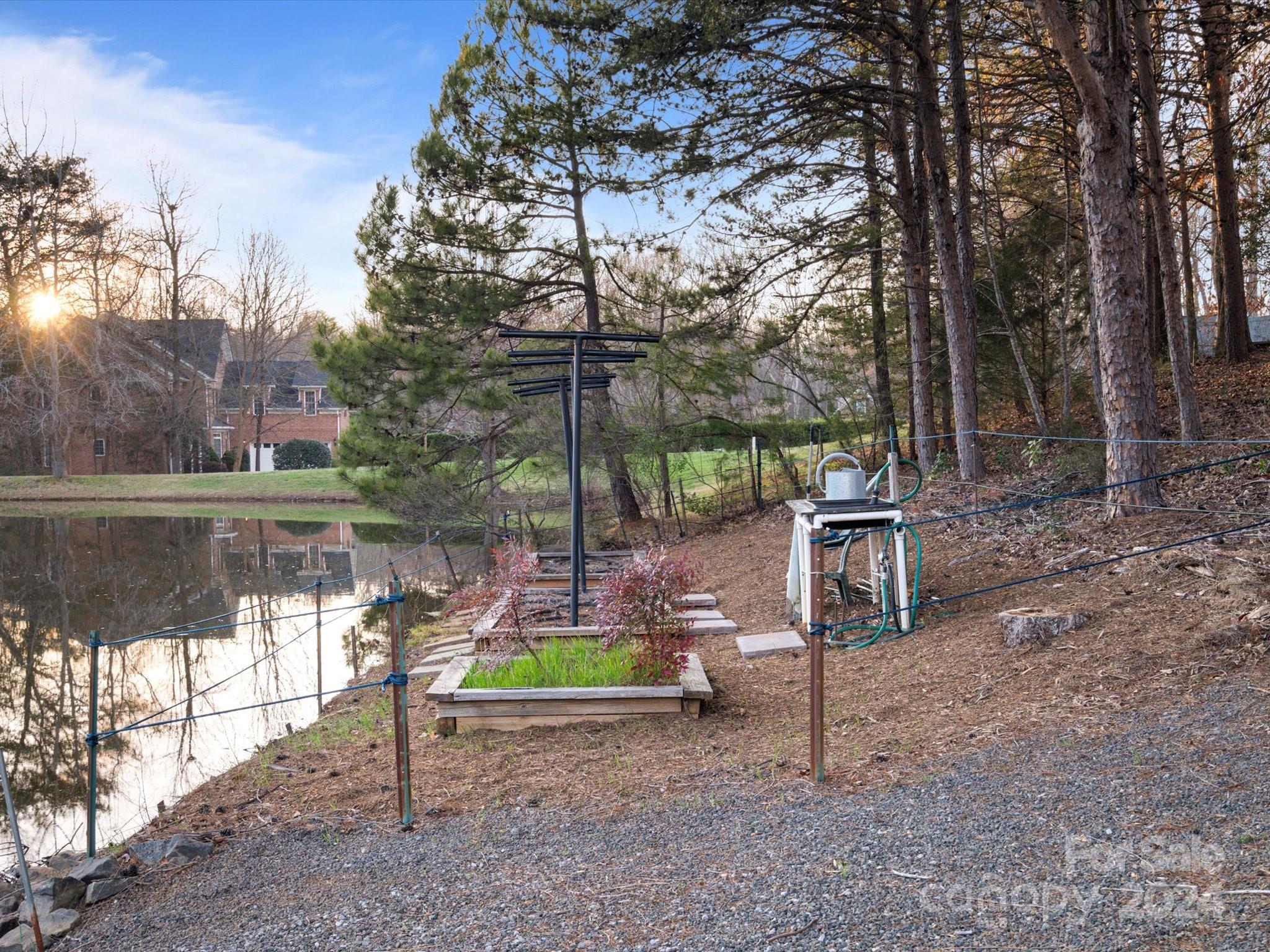 135 Spring Branch Road Fort Mill, SC 29715 - Photo 44 of 48 a backyard of a house with table and chairs