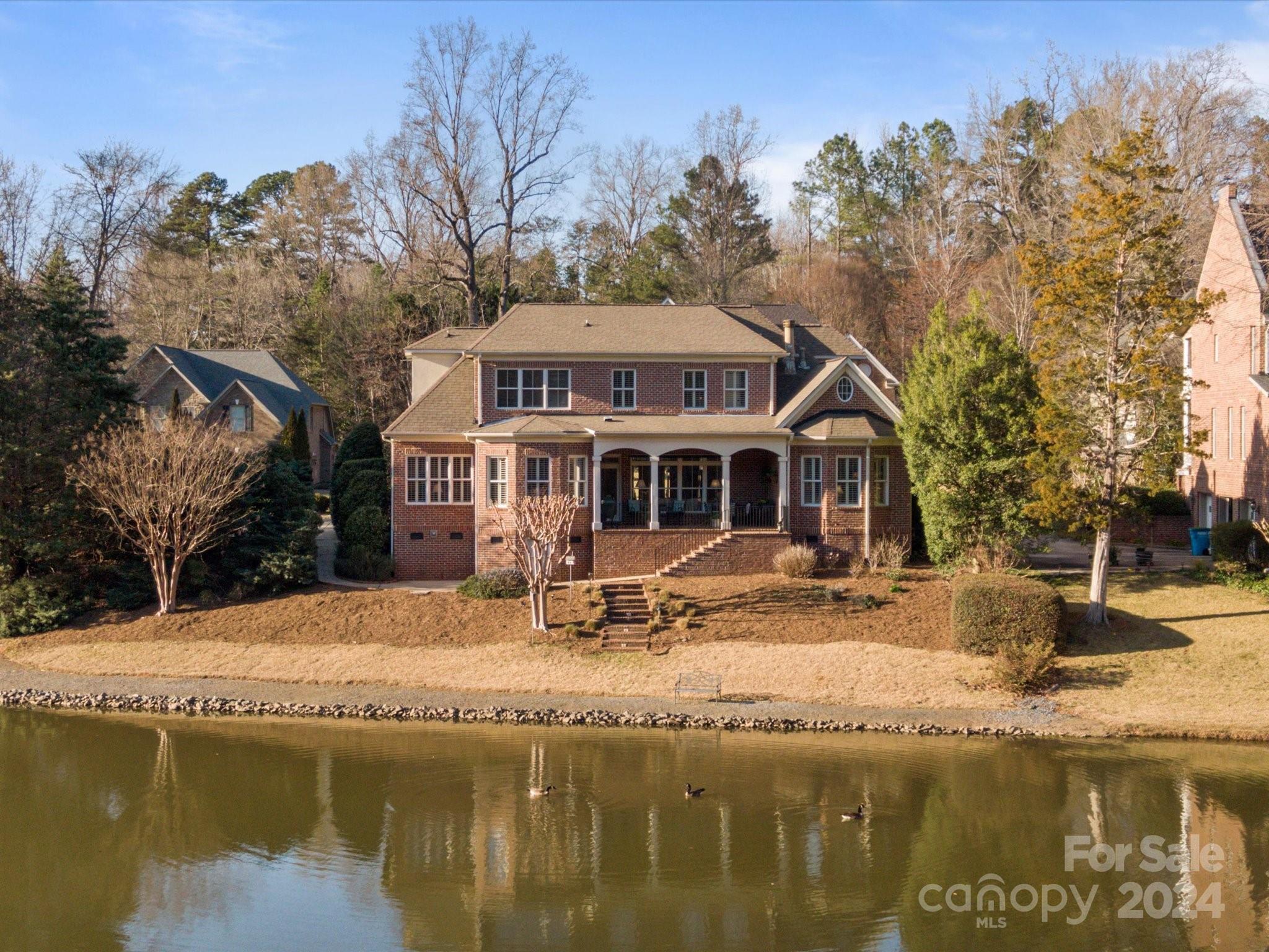 135 Spring Branch Road Fort Mill, SC 29715 - Photo 45 of 48 a view of a house with pool and sitting area