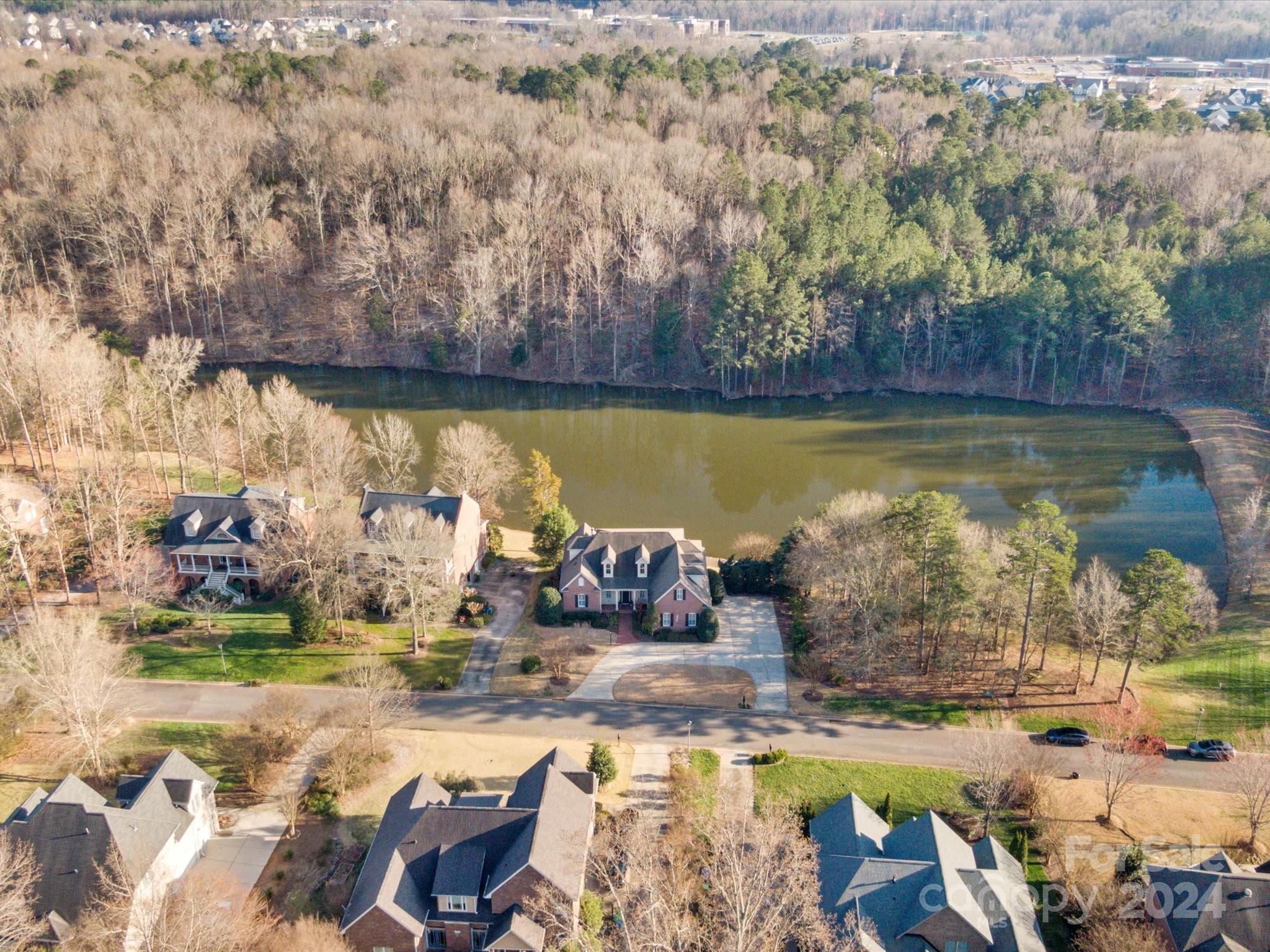135 Spring Branch Road Fort Mill, SC 29715 - Photo 5 of 48 a view of a lake with a house