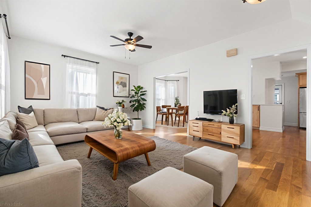12 Viden Road Quincy, MA 02169 - Photo 1 of 29 a living room with furniture a flat screen tv and a large window