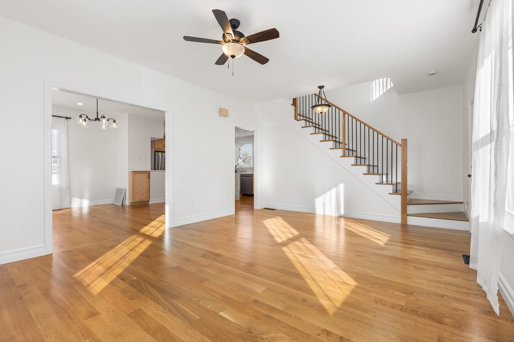 12 Viden Road Quincy, MA 02169 - Photo 14 of 29 a view of an empty room with wooden floor and a ceiling fan